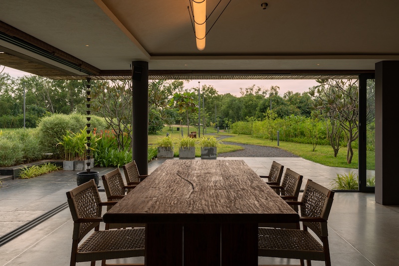 The open-plan, glass-enclosed all-day dining boasts a live edge table from the award-winning design brand Josmo Studio. ( Image Credit: Amaraanth)