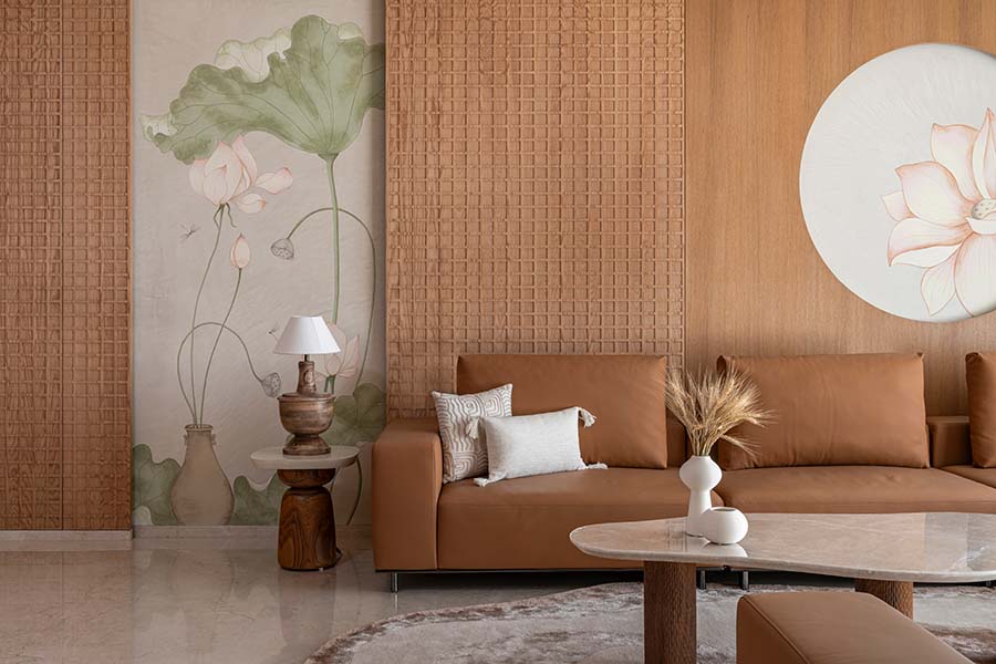 The striking wall art, by Rogán Designs, paired with a plush sofa from Shield Cons, and decor accents from Gulmohar Lane and Westside Home anchors the space with warm, velvety hues. (Image Credits: Nilkanth Bharucha)